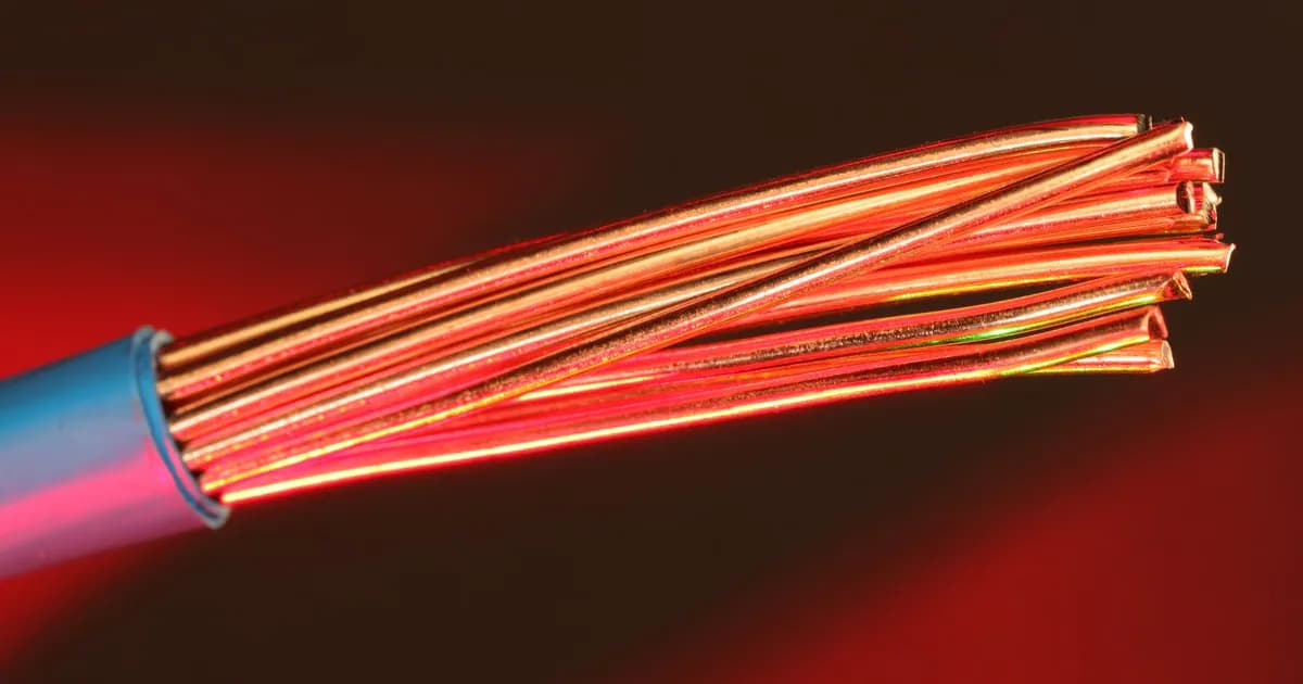Detailed image of copper wires illuminated by red light
