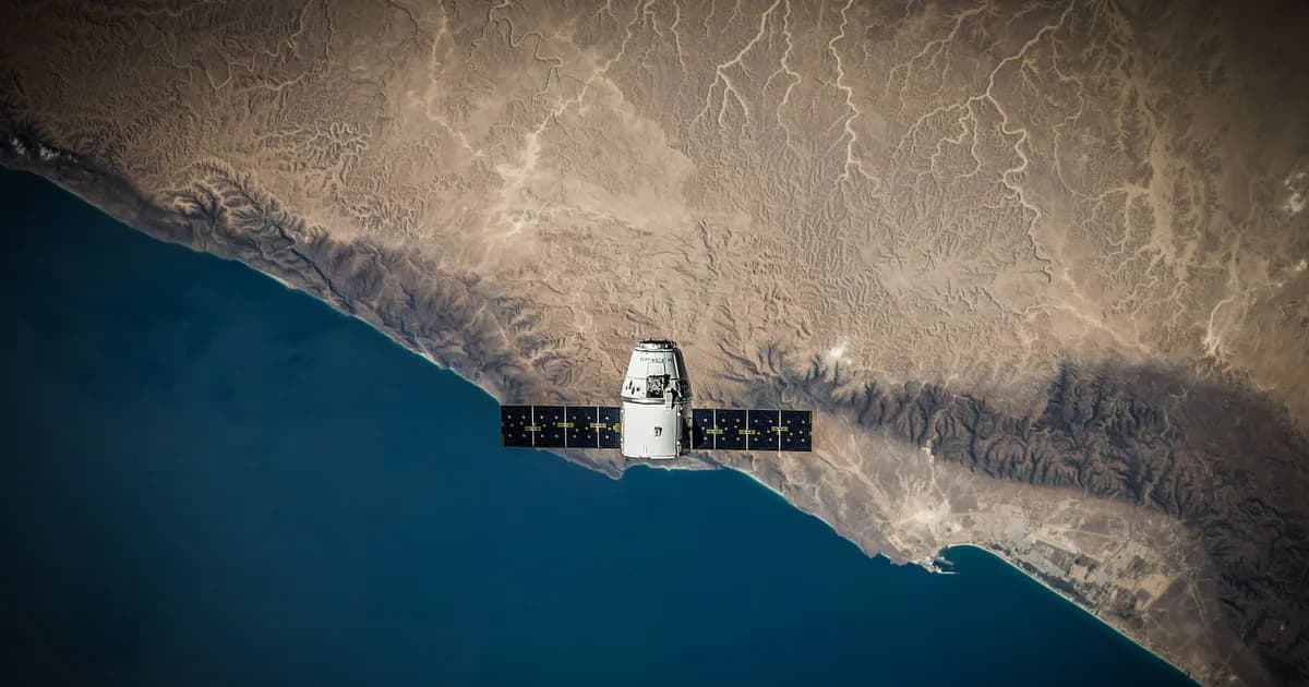 A satellite hovering above Earth's coastline, captured from space