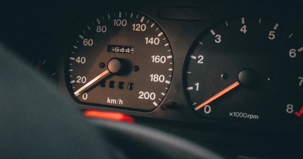 Detailed view of a car's speedometer and tachometer displaying speed and RPM
