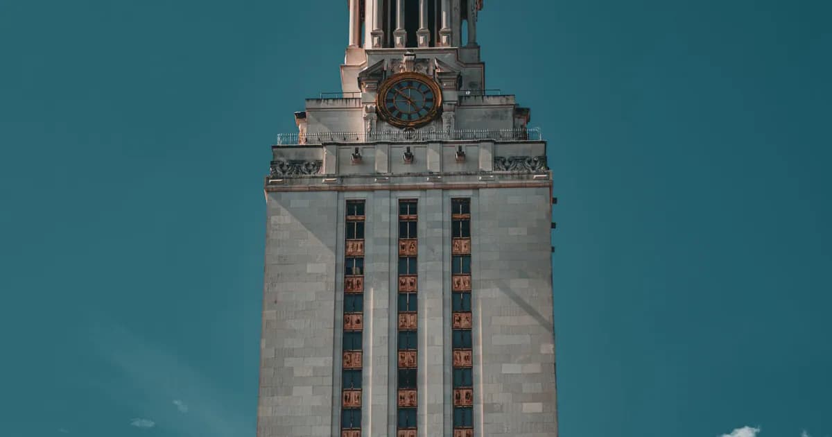 The University of Texas Tower against a clear blue sky in Austin, Texas