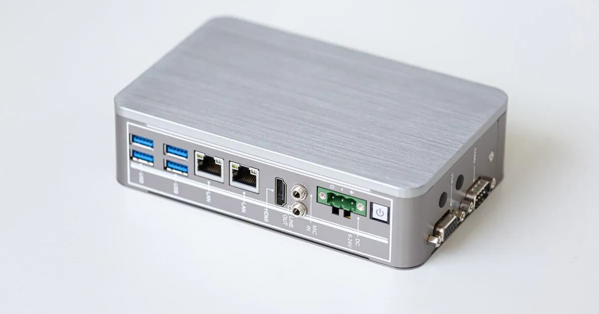 A silver network router with multiple USB ports