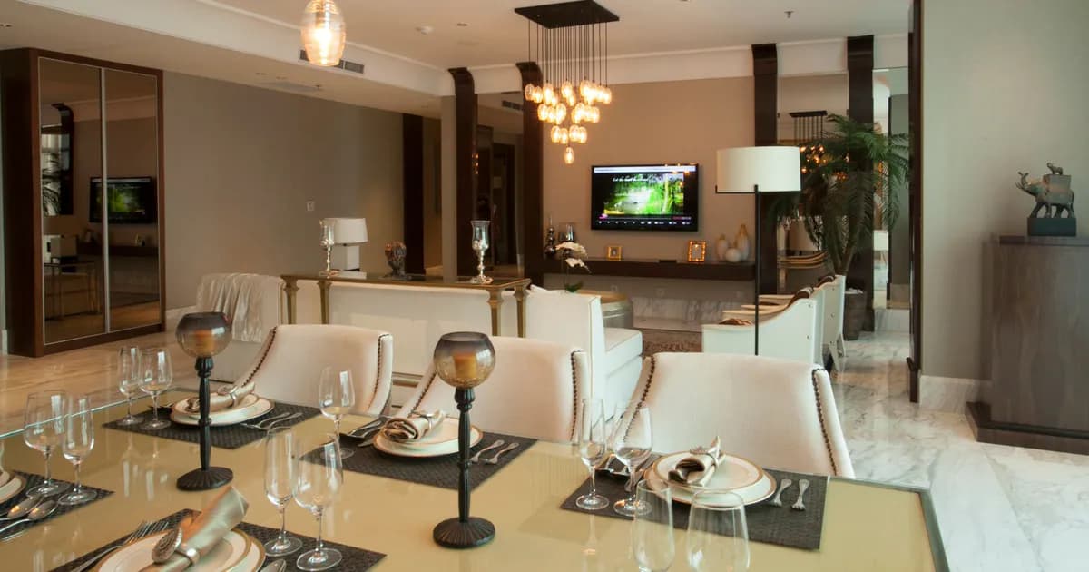 Luxurious dining and living room with modern decor and ambient lighting