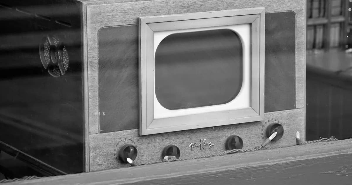 Black and white image of a vintage television set with classic design