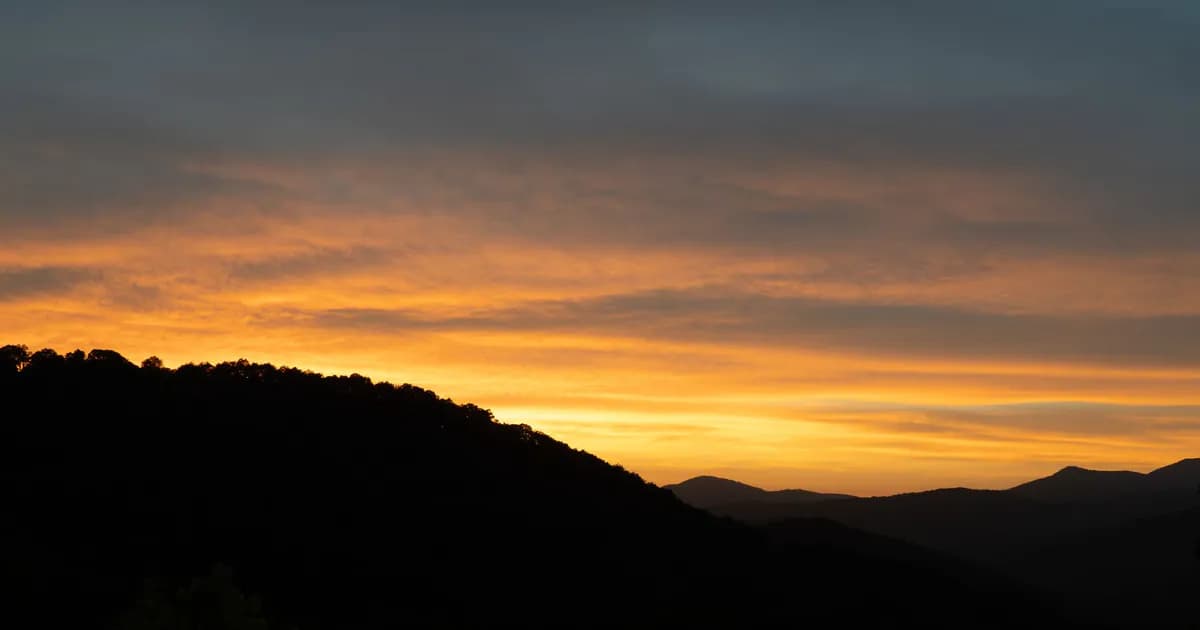 Stunning sunset with glowing skies over the Blue Ridge Mountains, Asheville, North Carolina