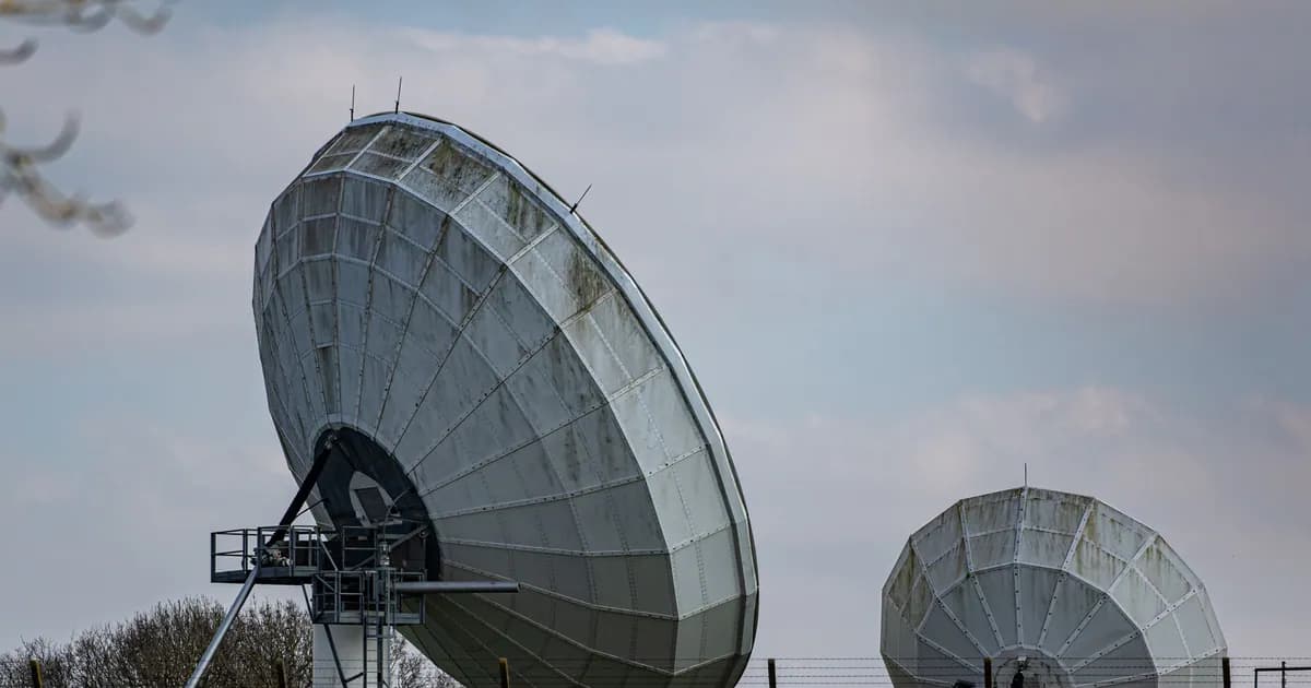 Two large radio telescopes in an outdoor setting